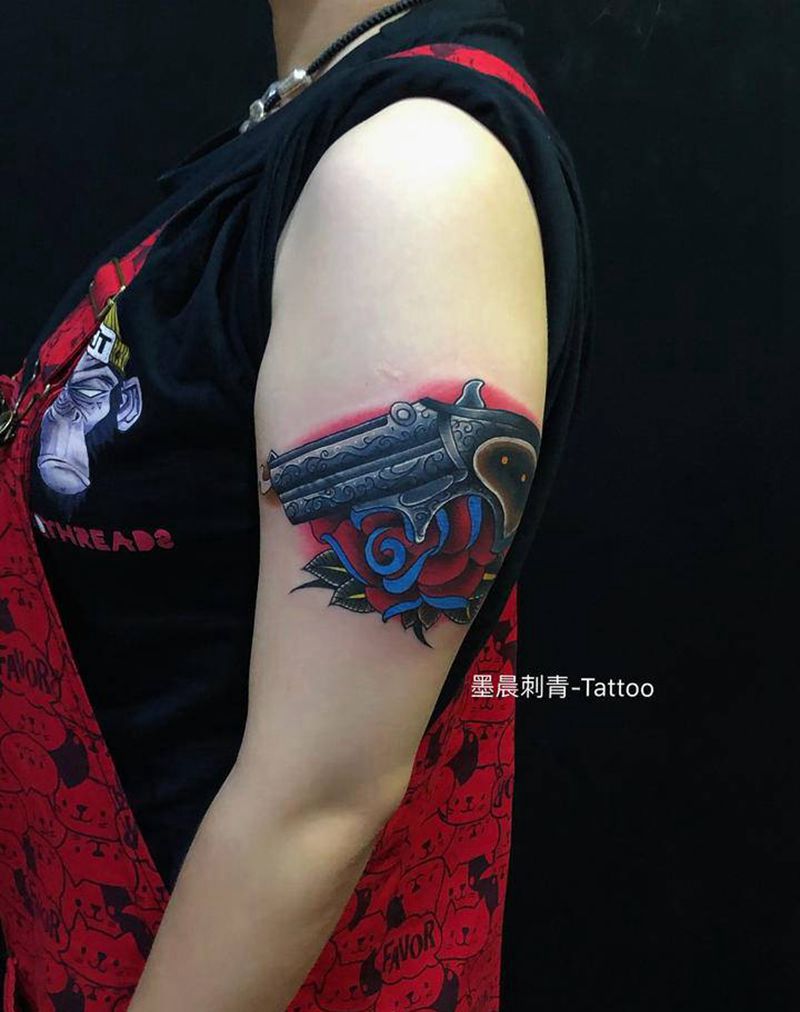 枪花纹身图片_手臂纹身图案