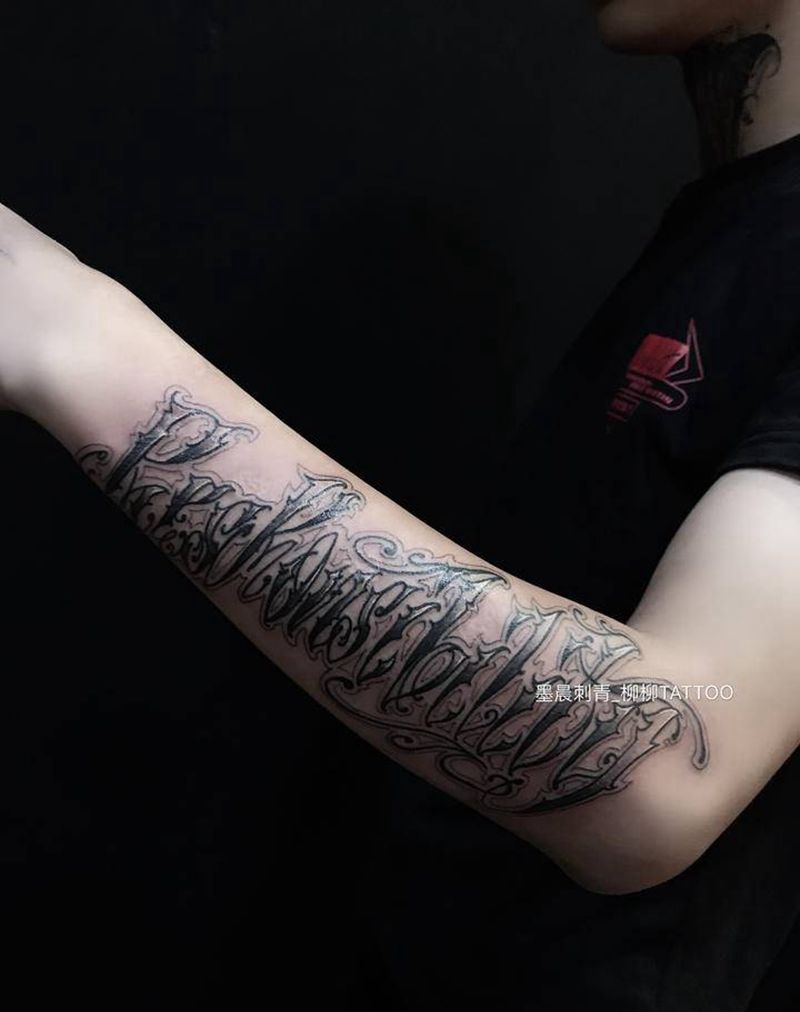 其卡诺花体字纹身图片_手臂花体字纹身图案