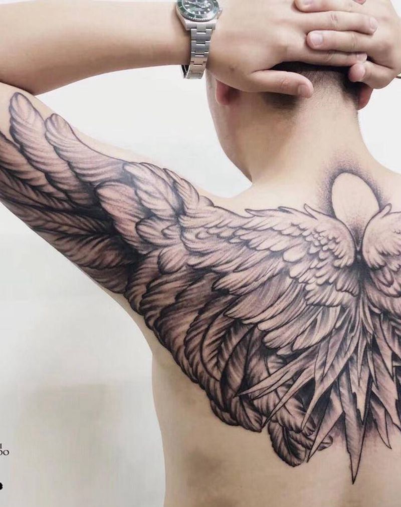 天使的翅膀纹身图片_肩部颈部点刺纹身图案