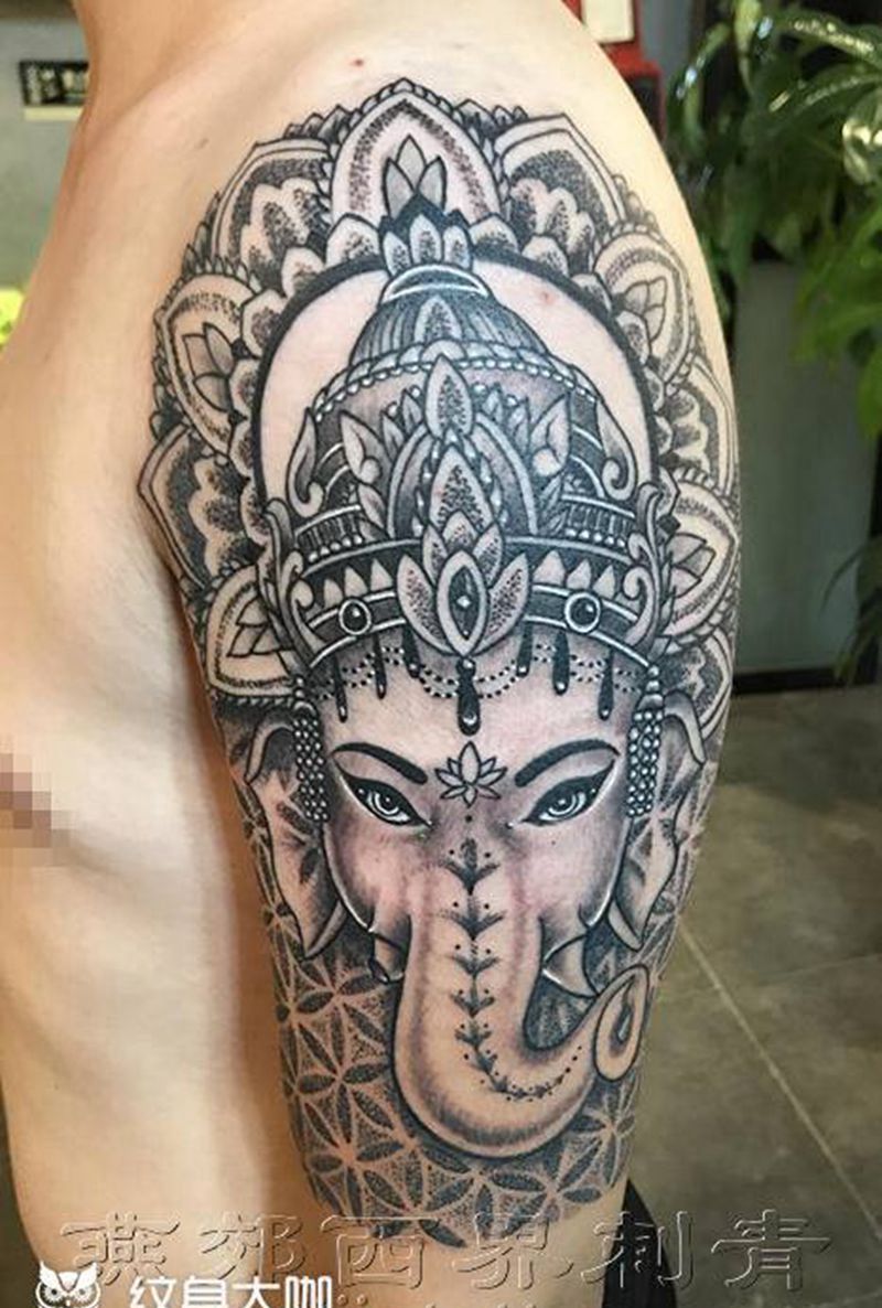 大臂象神纹身图片_手臂新传统点刺纹身图案