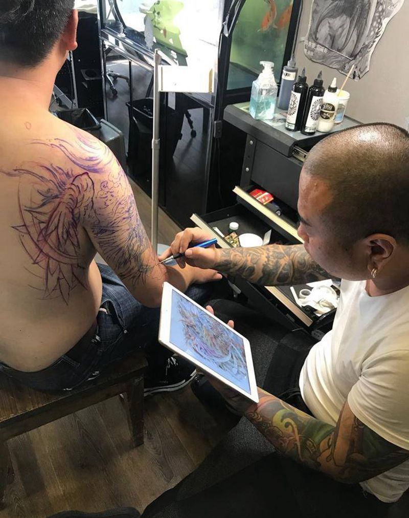 凤凰花臂纹身图片