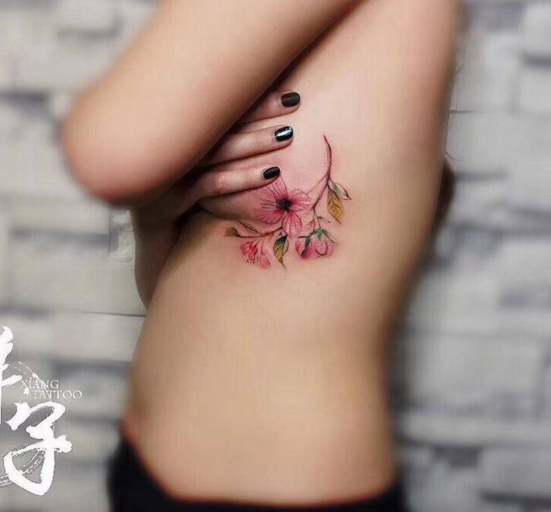 桃花枝纹身图片_成品腰部胸部清新植物静物纹身图案