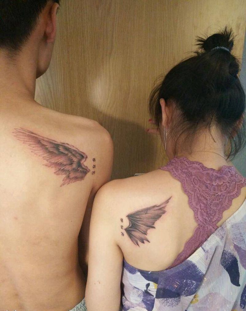 情侣翅膀纹身图片_肩部手臂欧美写实新传统翅膀天使恶魔纹身图案