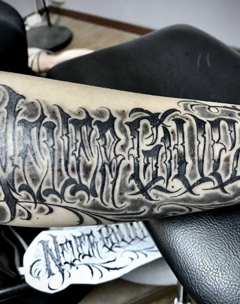 NeverGiveUp纹身图片_手臂花体字永不放弃NeverGiveUp纹身图案