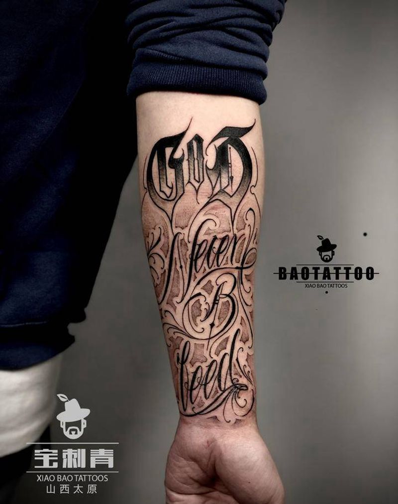 God Never Bleed纹身图片_手臂花体字纹身图案