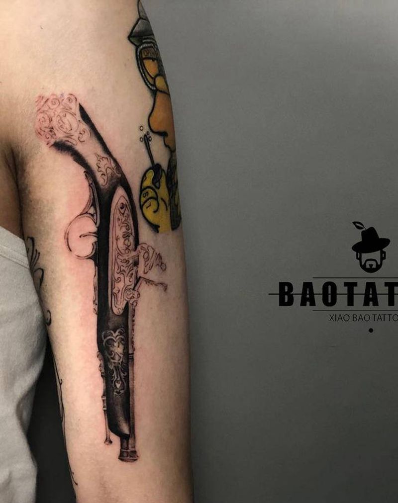 老式火枪未完纹身图片_手臂欧美写实纹身图案