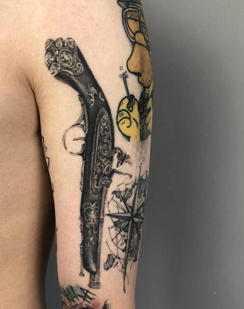 恢复后纹身图片_手臂火枪纹身图案