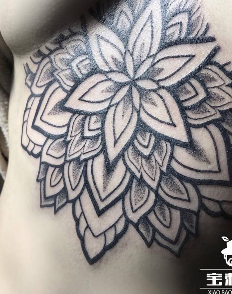 曼陀罗待续纹身图片_胸部点刺几何曼陀罗纹身图案
