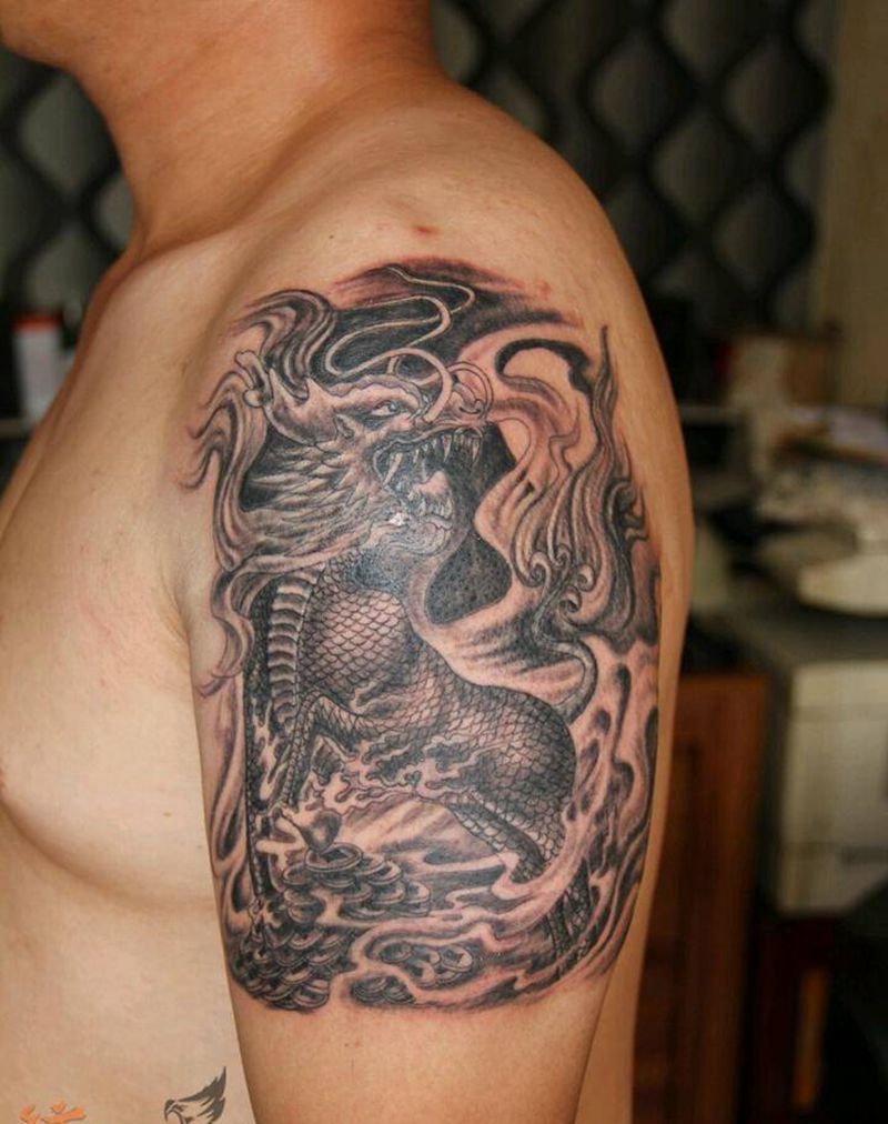 麒麟送宝纹身图片_肩部手臂传统国画动物鬼神纹身图案