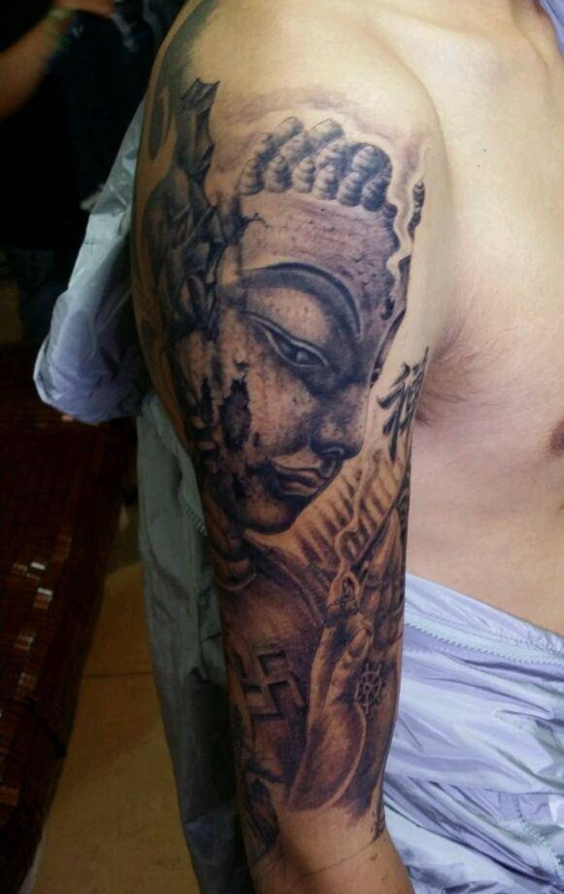 石佛花臂进行中纹身图片_手臂传统人物植物静物鬼神纹身图案