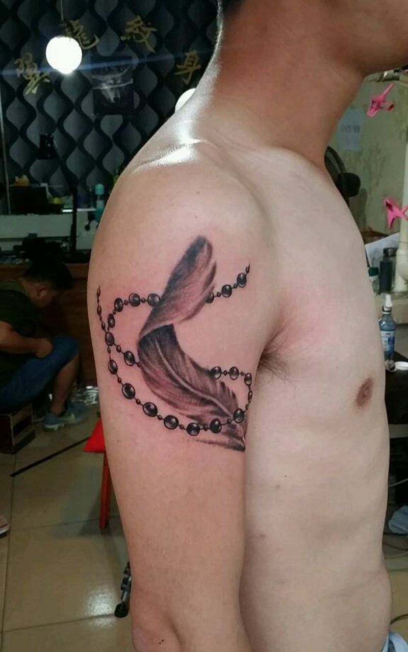 羽毛纹身图片_手臂静物成品纹身图案