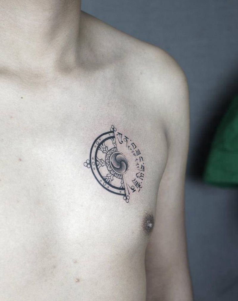 藏文 法轮纹身图片_胸部新传统花体字法轮西藏元素法轮纹身图案