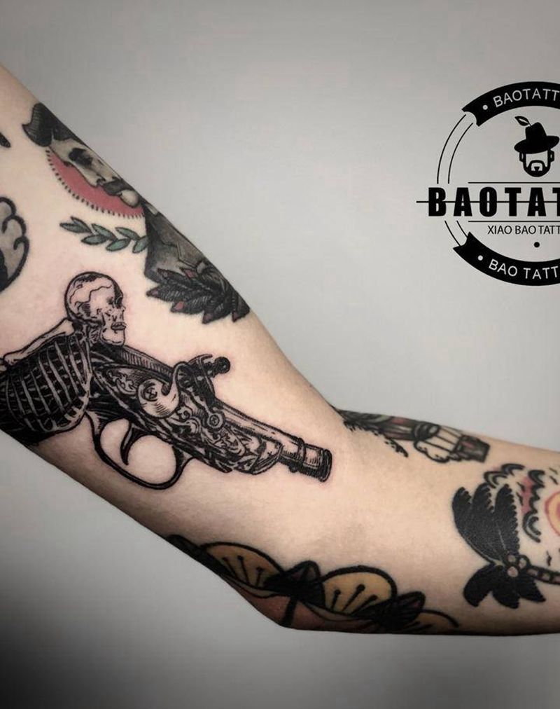 火枪纹身图片_手臂纹身图案