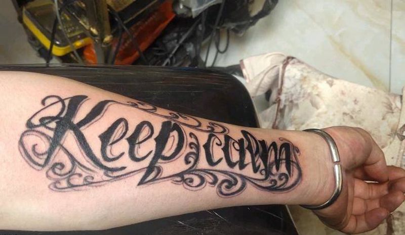 花体字纹身图片_手臂花体字纹身图案