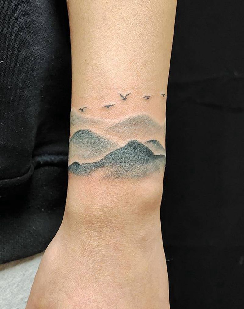 山水之间纹身图片_手臂新传统纹身图案