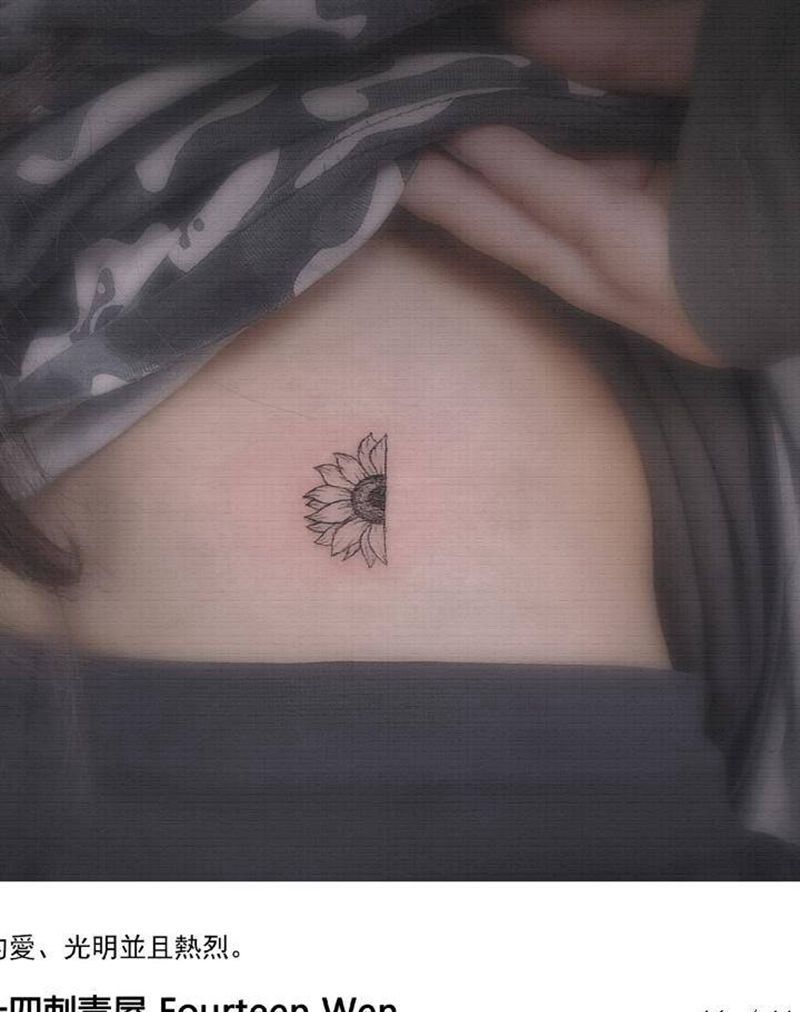 太阳花纹身图片_腰部点刺纹身图案