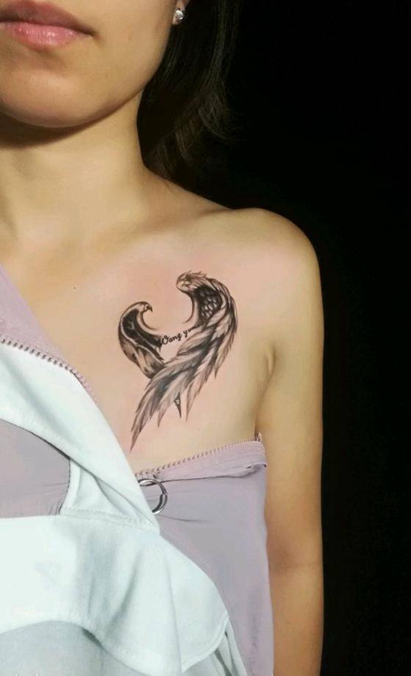 守护纹身图片_胸部肩部新传统欧美写实天使翅膀纹身图案