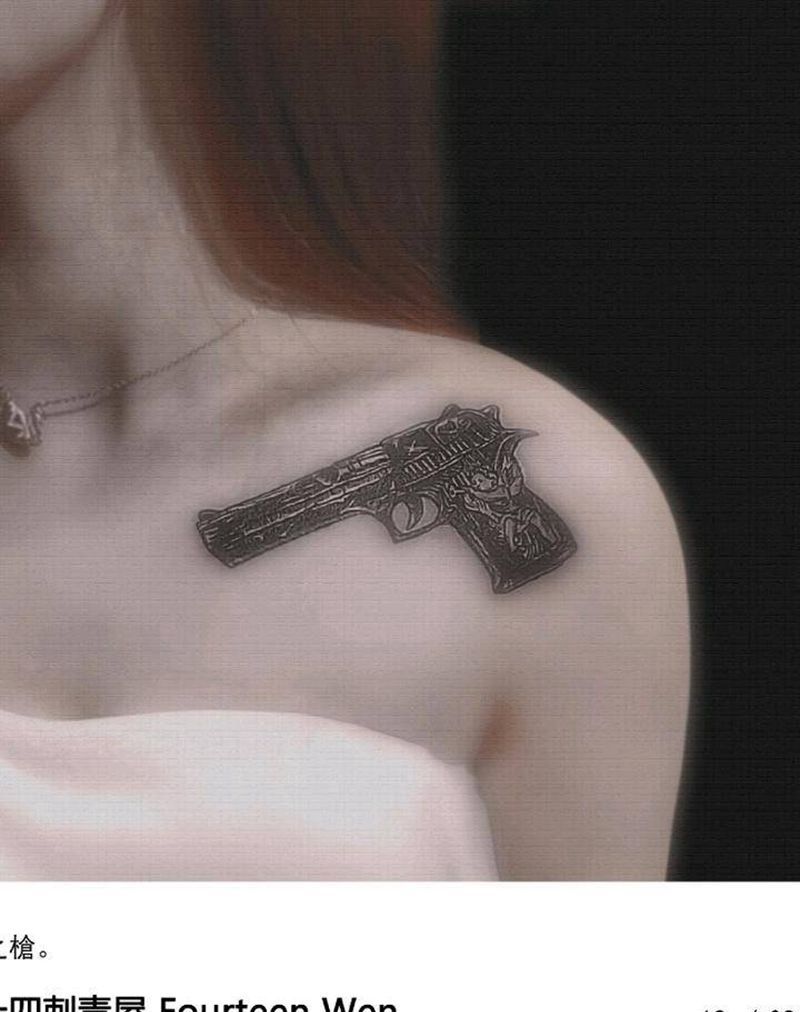 命运之枪纹身图片_胸部肩部纹身图案