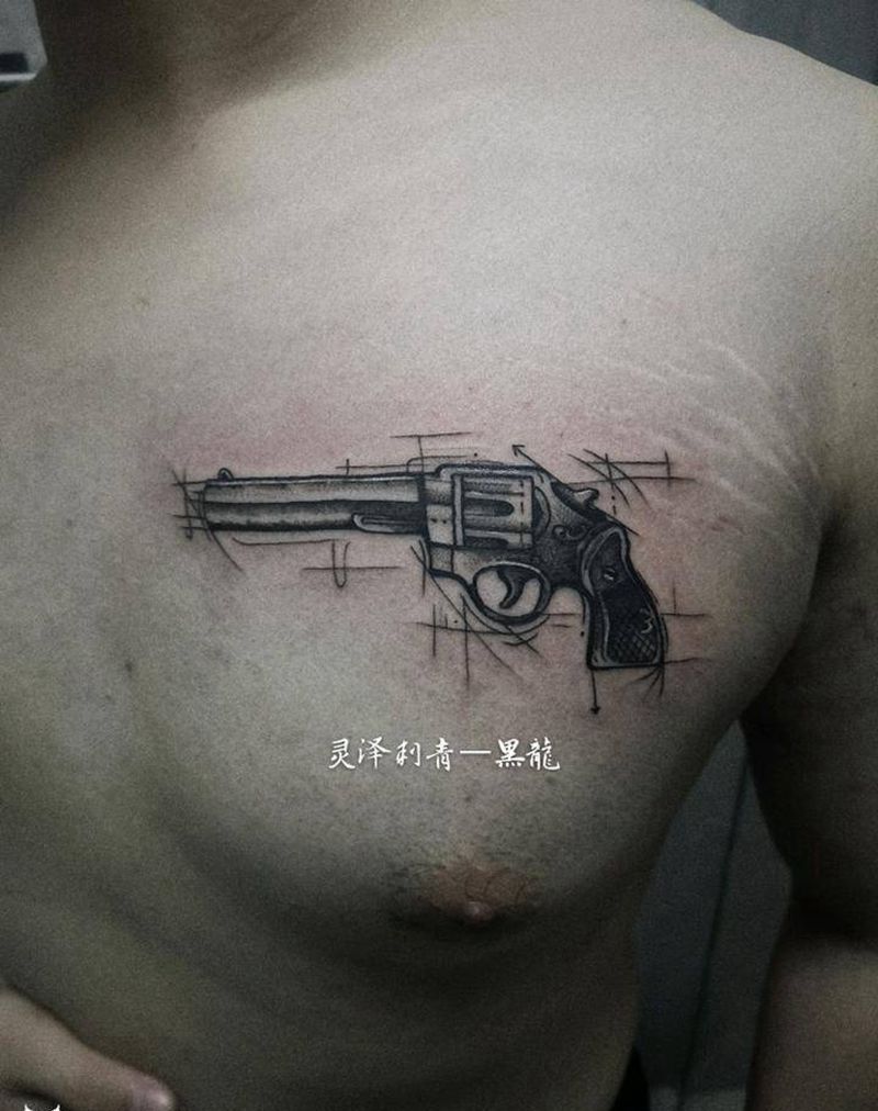 点刺手枪纹身图片_胸部点刺枪纹身图案