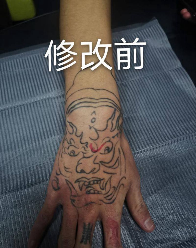 修改毁皮纹身图片_手部新传统雷神鬼头纹身图案