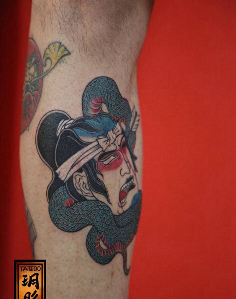 生首纹身图片_腿部纹身图案