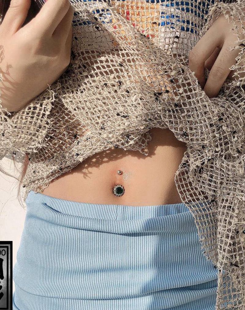 穿孔脐钉纹身图片_穿孔纹身图案