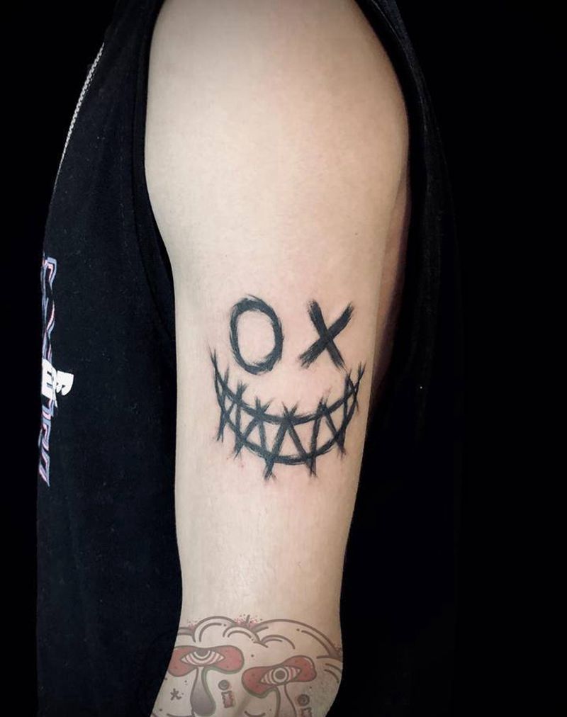 笑脸纹身图片_手臂纹身图案