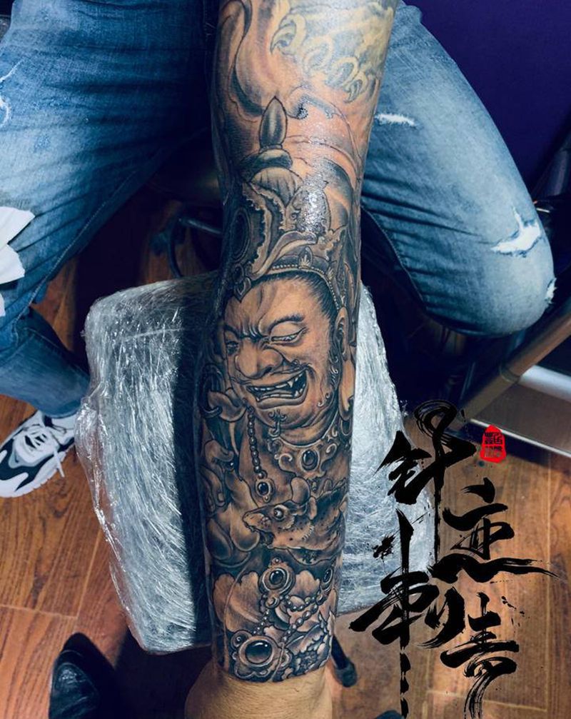 黄财神花臂纹身图片_手臂新传统纹身图案