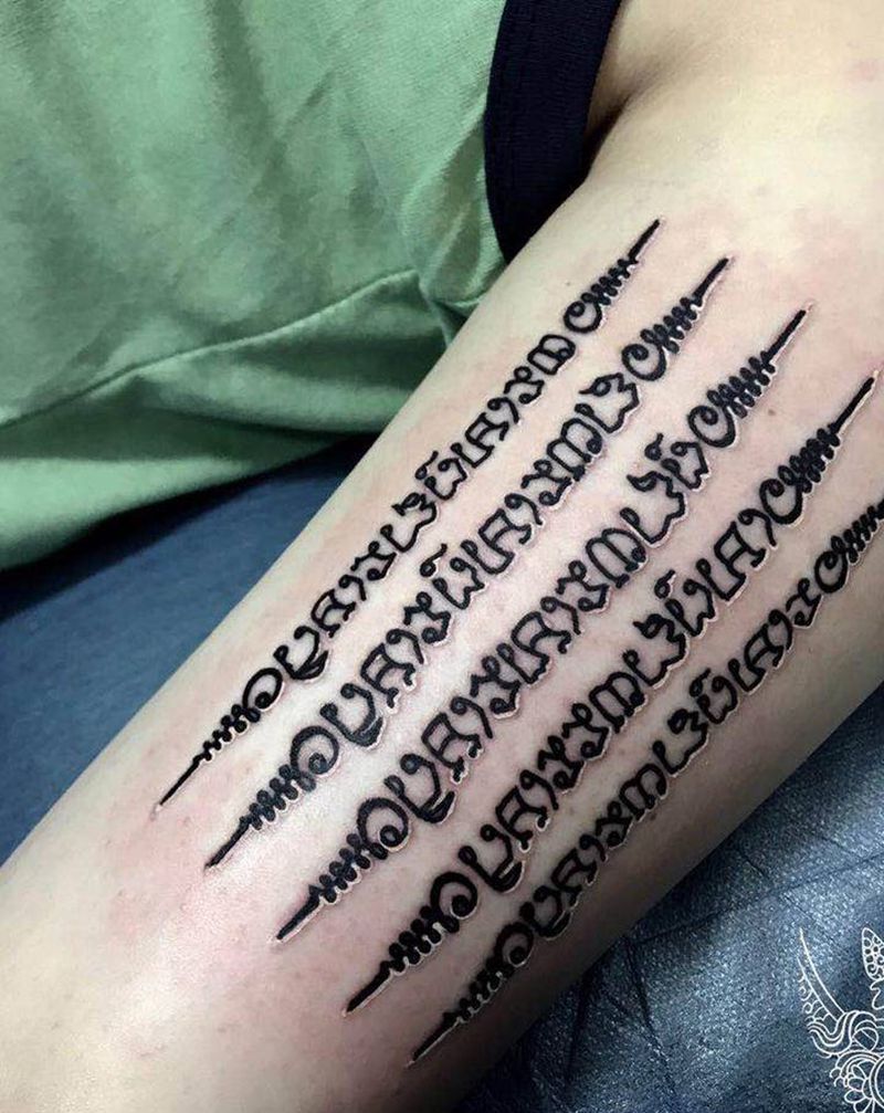 五条经文纹身图片_手臂图腾点刺纹身图案