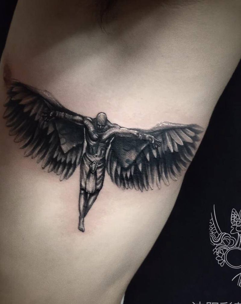 遮盖哈纹身图片_腰部图腾水墨纹身图案