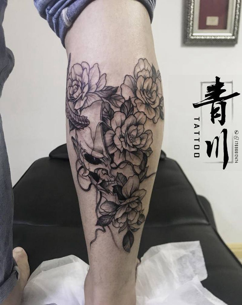 般若素花纹身图片_腿部点刺图腾纹身图案