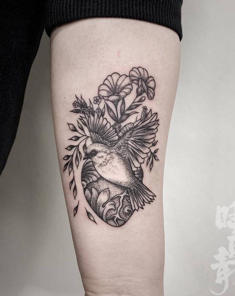 极乐鸟纹身图片_手臂点刺几何鸟纹身图案