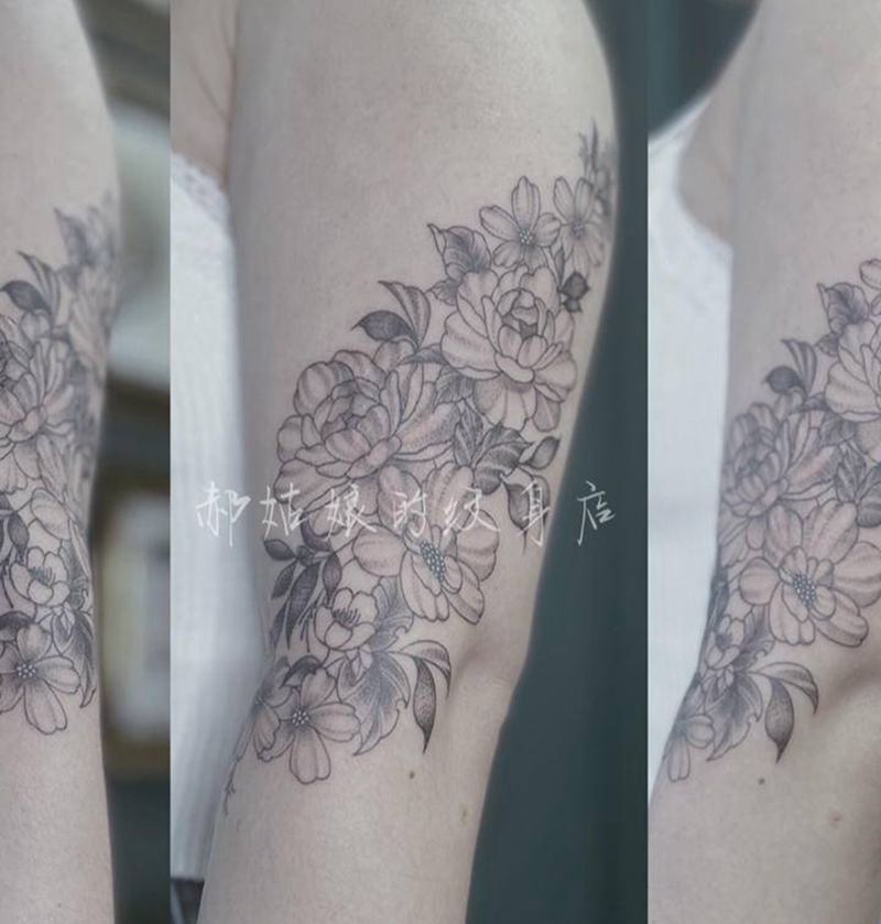 素花疤痕遮盖纹身图片_手臂点刺牡丹植物叶子纹身图案
