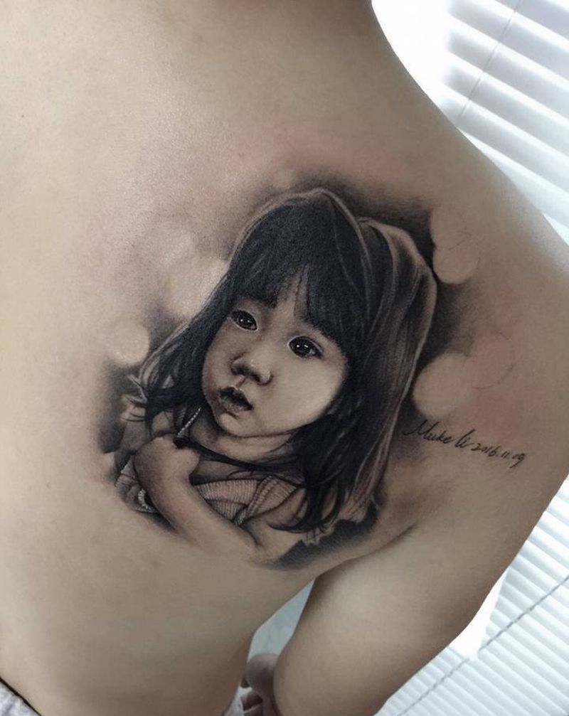 写实小宝贝纹身图片_背部欧美写实纹身图案