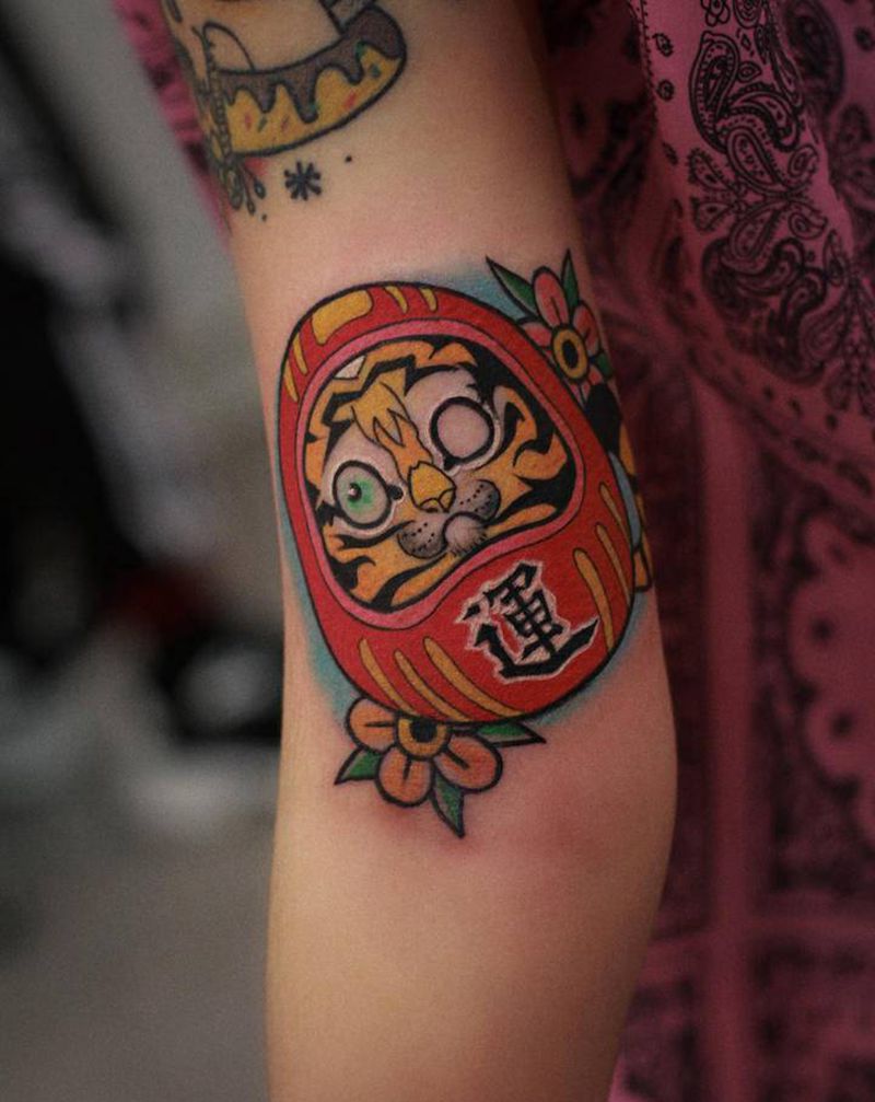 达摩蛋纹身图片_手臂纹身图案