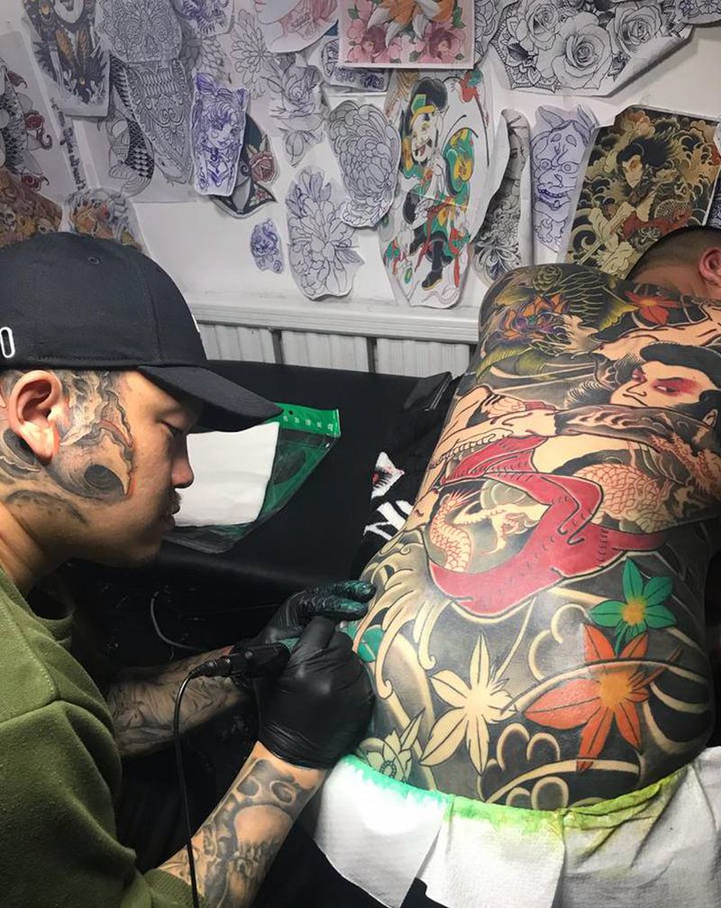 添加修改后纹身图片_背部老传统纹身图案