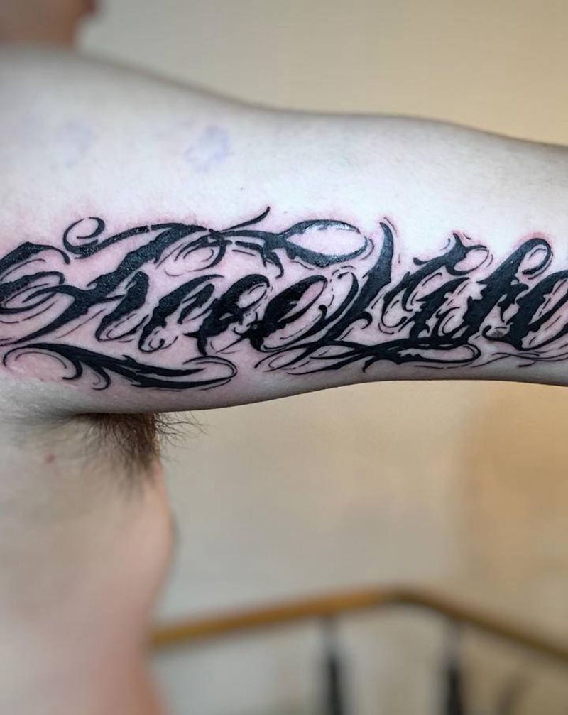 花体字纹身图片_手臂花体字纹身图案