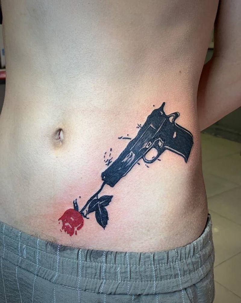 枪花纹身图片_腰部图腾纹身图案