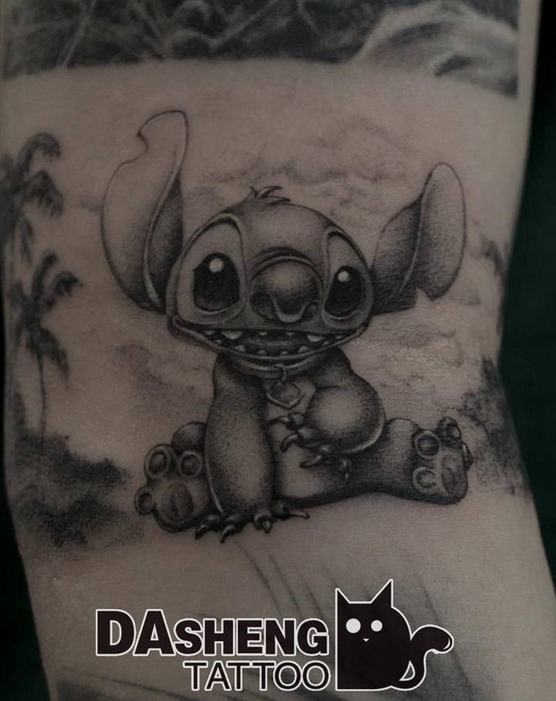 史迪仔纹身图片_手臂点刺史迪仔纹身图案