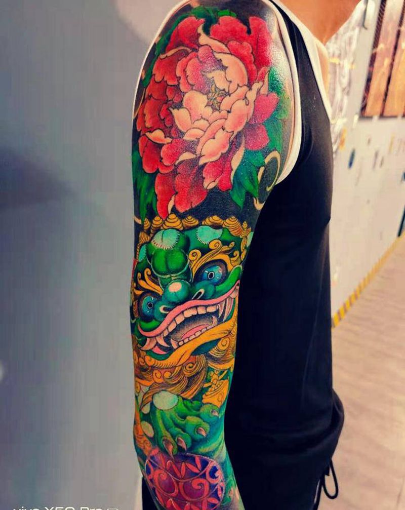 唐狮花臂纹身图片_手臂纹身图案