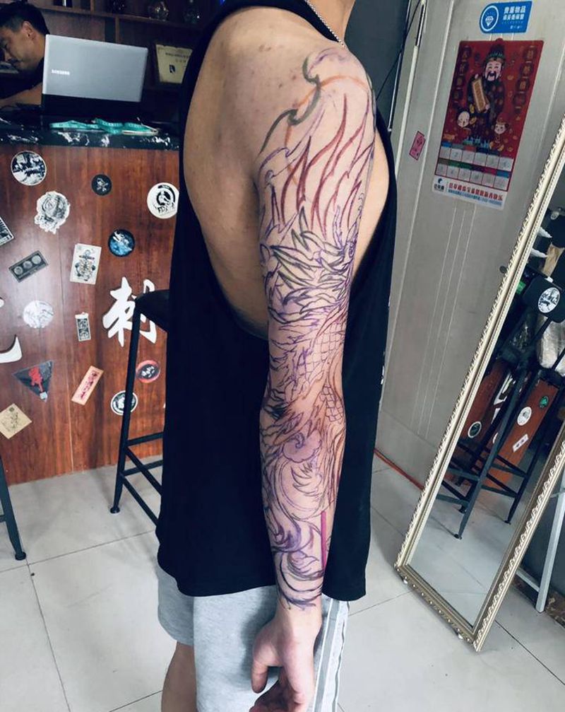 花臂凤凰线条纹身图片_手臂新传统凤凰牡丹云雾纹身图案