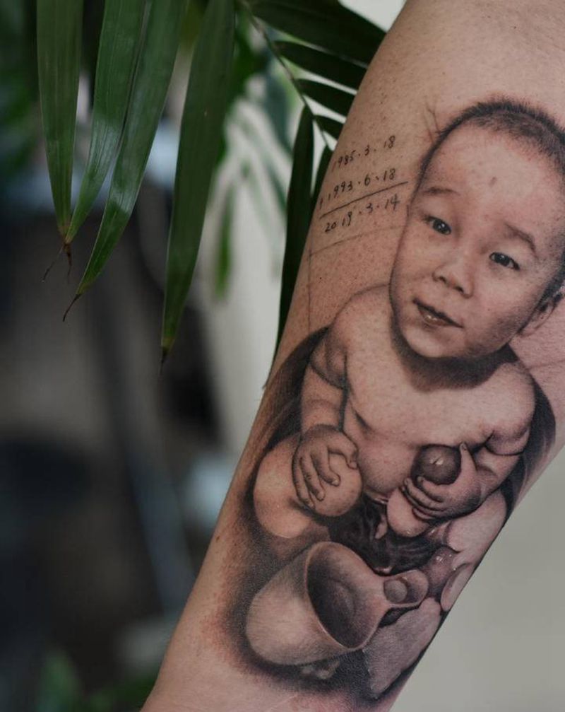 宝贝纹身图片_手臂欧美写实纹身图案