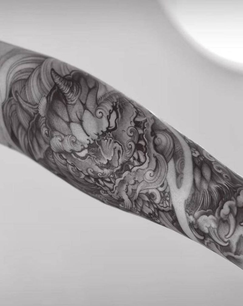 狮子唐纹身图片_手臂新传统唐狮子纹身图案