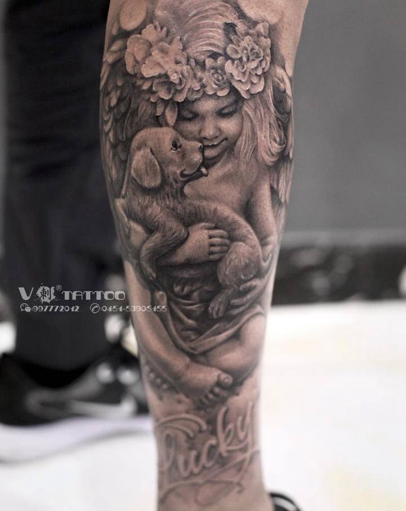 我的天使纹身图片_腿部欧美写实天使狗狗哈尔滨纹身图案