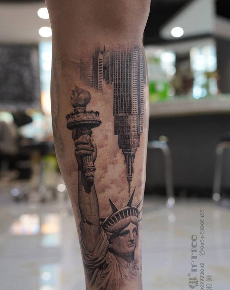 自由女神与帝国大厦纹身图片_腿部欧美写实自由女神包小腿超写实纹身图案