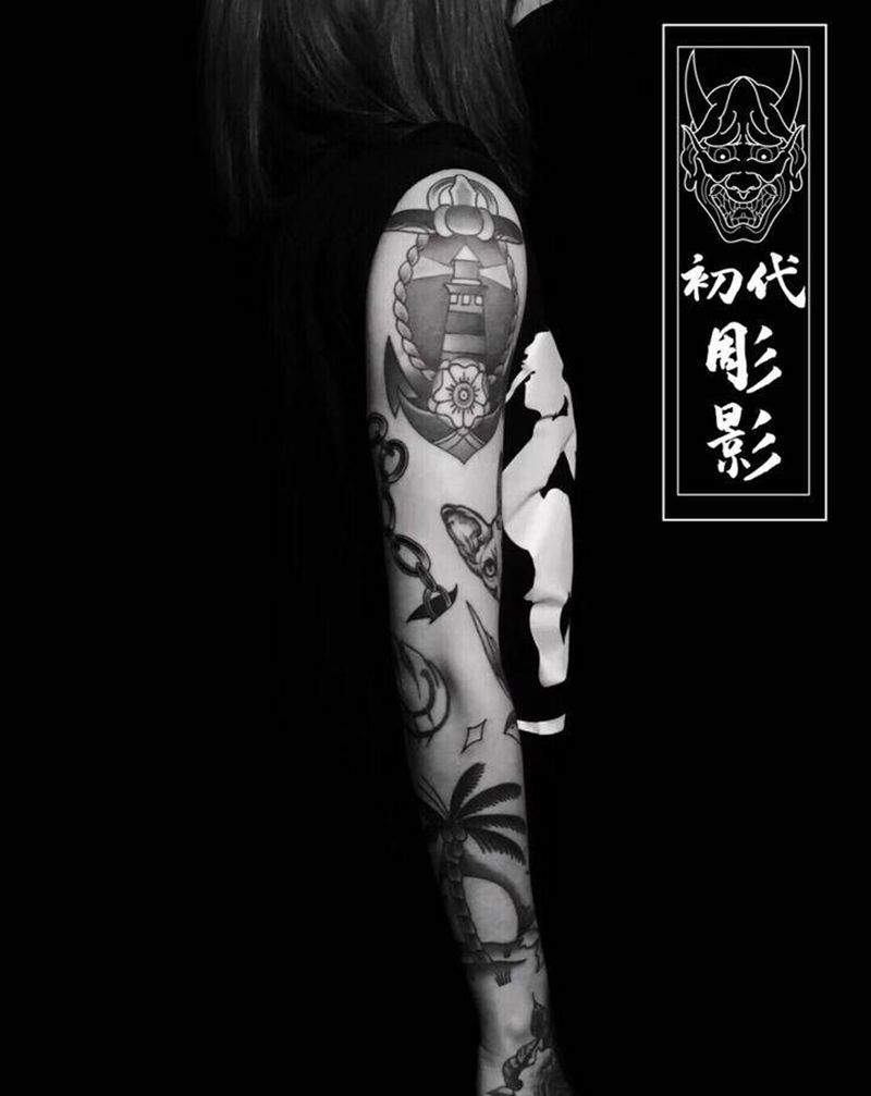 school花臂纹身图片_手臂Old School椰子树船锚燕子纹身图案