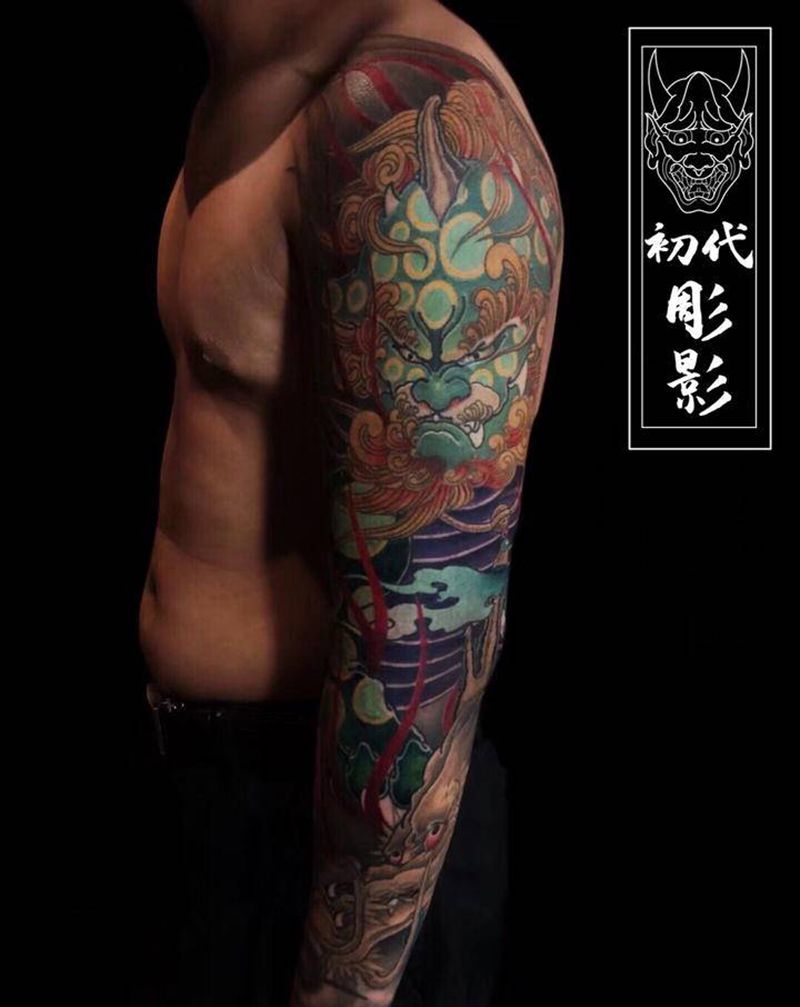 唐狮子，龙花臂纹身图片_手臂新传统唐狮子龙花臂纹身图案