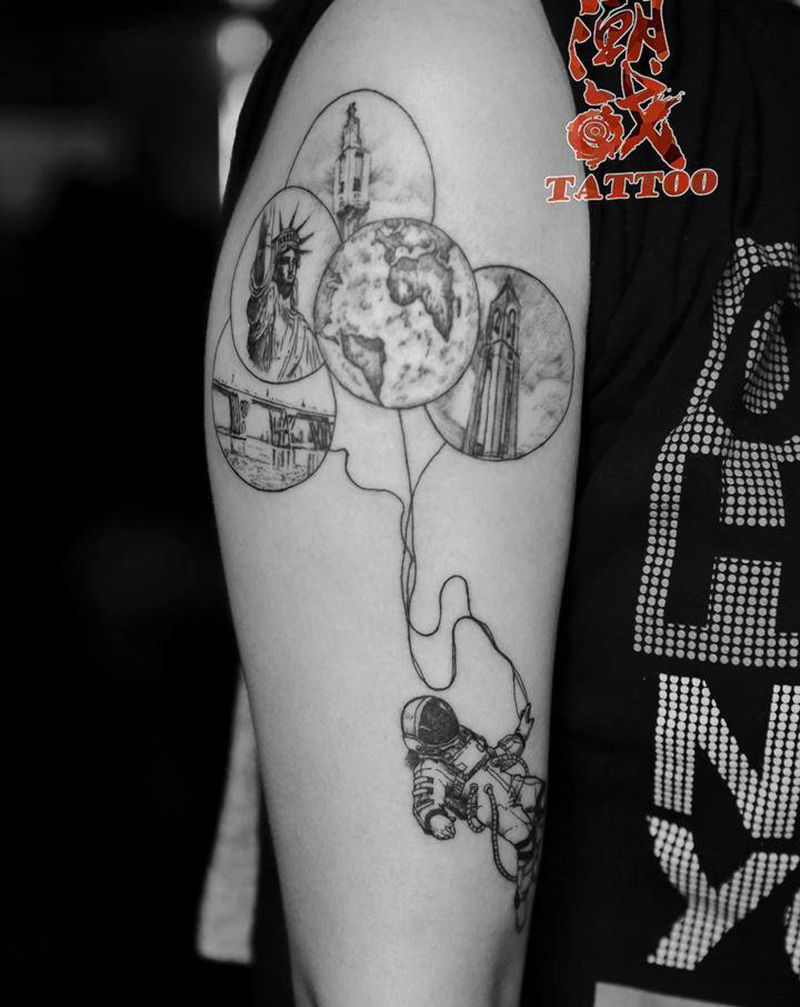 梦想家纹身图片_手臂欧美写实点刺宇航员纹身图案