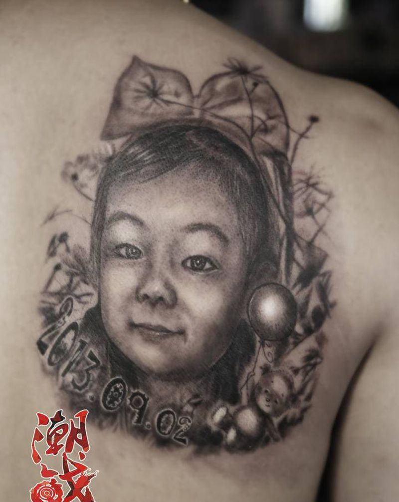 我的宝贝纹身图片_背部欧美写实肖像纹身图案