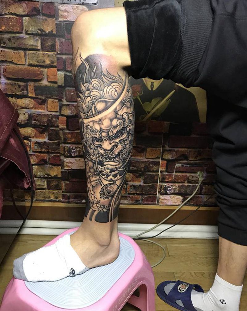 唐狮牡丹包小腿纹身图片_腿部新传统纹身图案